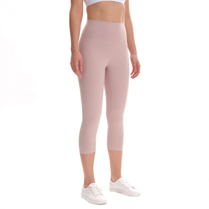 Pantaloni potati elastici di sport dei pantaloni delle ghette dell'anca di forma fisica di yoga delle donne senza cuciture su ordinazione delle ghette che eseguono le calzamaglia di formazione più la dimensione