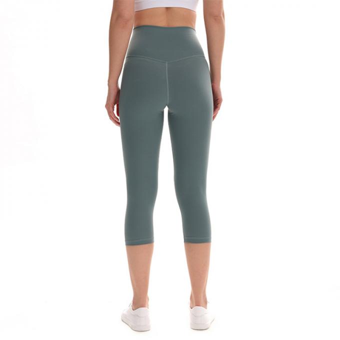 Pantaloni potati elastici di sport dei pantaloni delle ghette dell'anca di forma fisica di yoga delle donne senza cuciture su ordinazione delle ghette che eseguono le calzamaglia di formazione più la dimensione