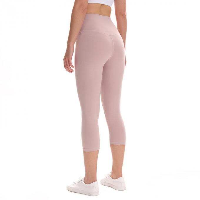 Pantaloni potati elastici di sport dei pantaloni delle ghette dell'anca di forma fisica di yoga delle donne senza cuciture su ordinazione delle ghette che eseguono le calzamaglia di formazione più la dimensione