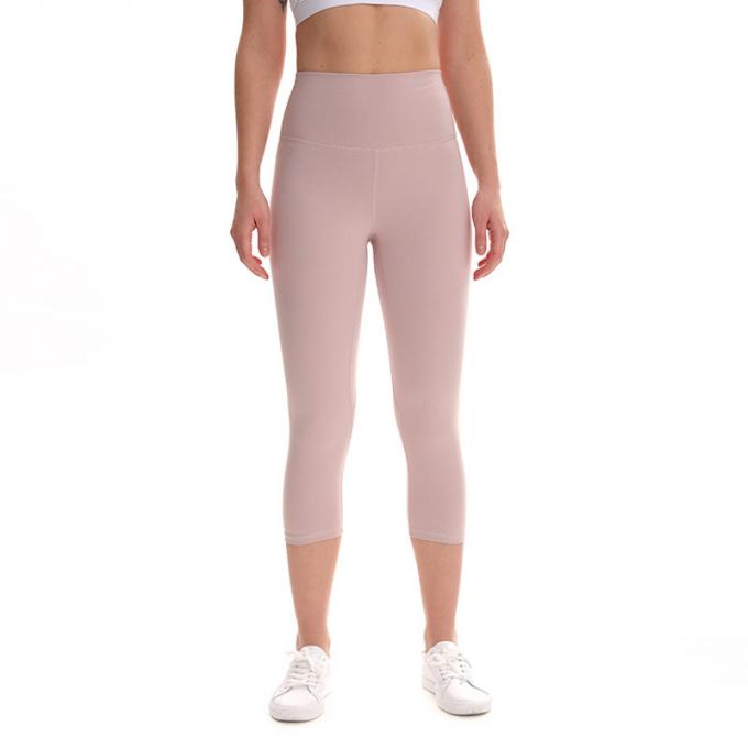 Pantaloni potati elastici di sport dei pantaloni delle ghette dell'anca di forma fisica di yoga delle donne senza cuciture su ordinazione delle ghette che eseguono le calzamaglia di formazione più la dimensione