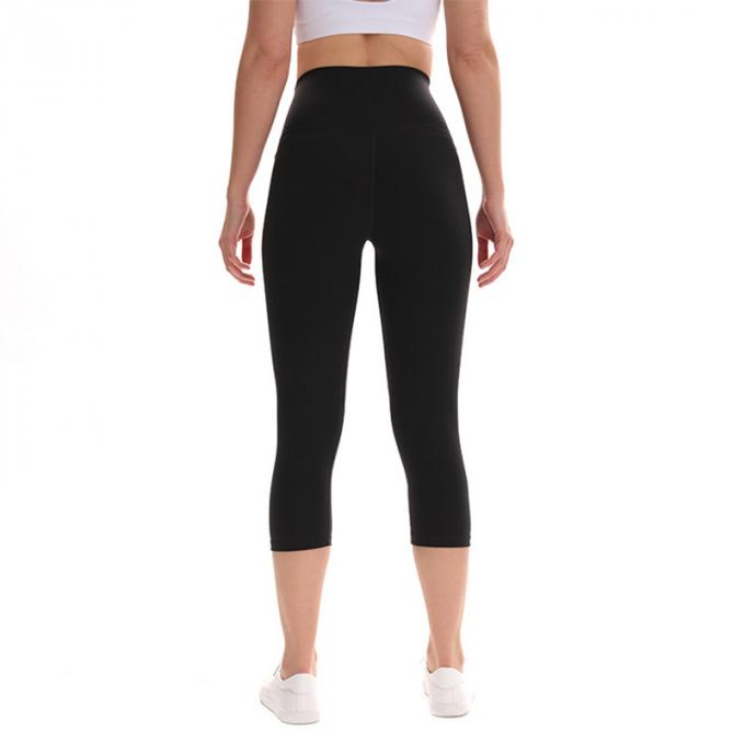Pantaloni potati elastici di sport dei pantaloni delle ghette dell'anca di forma fisica di yoga delle donne senza cuciture su ordinazione delle ghette che eseguono le calzamaglia di formazione più la dimensione