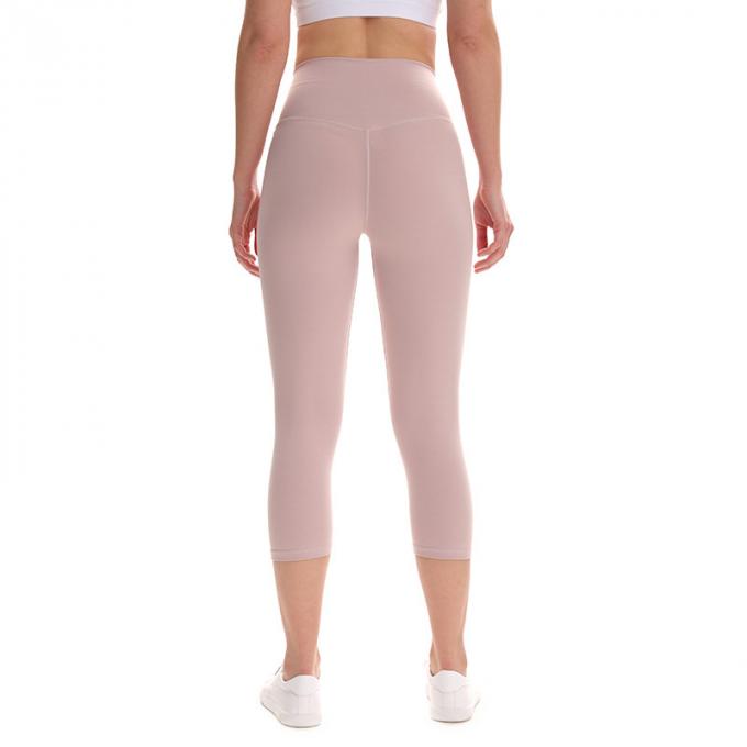 Pantaloni potati elastici di sport dei pantaloni delle ghette dell'anca di forma fisica di yoga delle donne senza cuciture su ordinazione delle ghette che eseguono le calzamaglia di formazione più la dimensione
