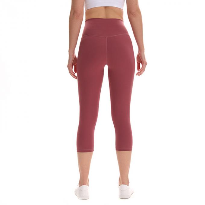 Pantaloni potati elastici di sport dei pantaloni delle ghette dell'anca di forma fisica di yoga delle donne senza cuciture su ordinazione delle ghette che eseguono le calzamaglia di formazione più la dimensione