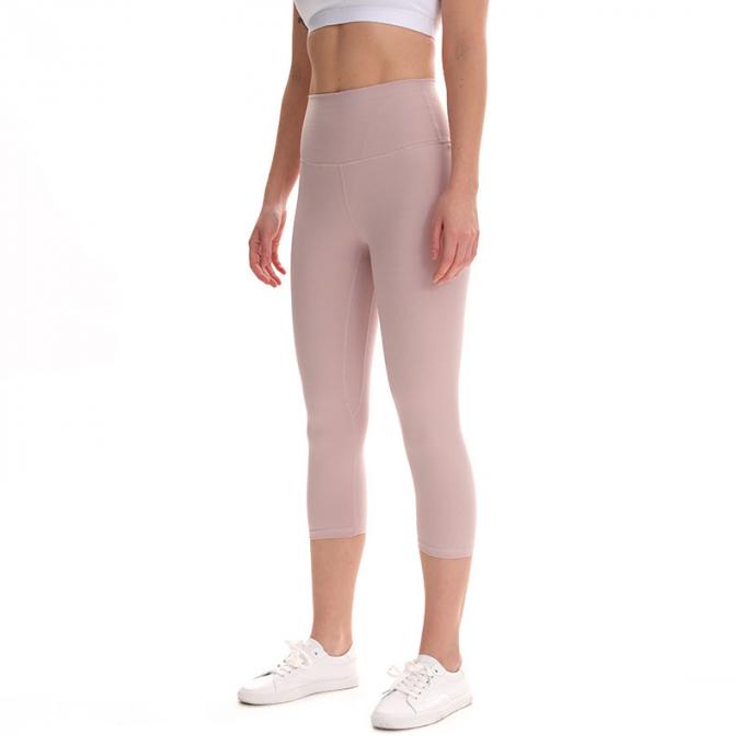Pantaloni potati elastici di sport dei pantaloni delle ghette dell'anca di forma fisica di yoga delle donne senza cuciture su ordinazione delle ghette che eseguono le calzamaglia di formazione più la dimensione